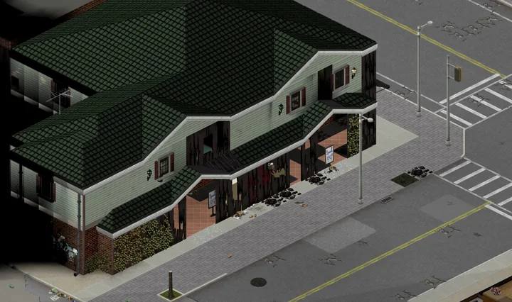 A game screenshot from above of a green-roofed two-storey corner shop, its ground-floor walls burned to black stumps, the tiled shop floor open to the street with price boards still standing inside, and broken glass and ash on the pavement.